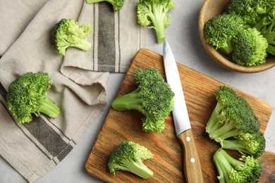 Photo of Fresh green broccoli on light table, flat lay