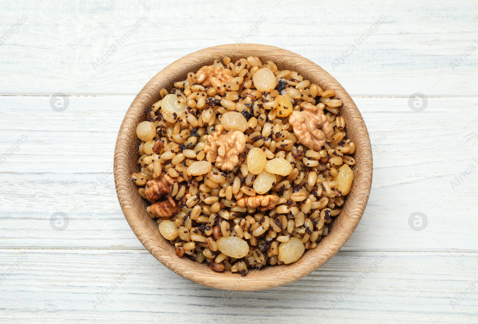 Traditional Christmas slavic dish kutia on white wooden table, top view Photo of Traditional Christmas slavic dish kutia on white wooden table, top view