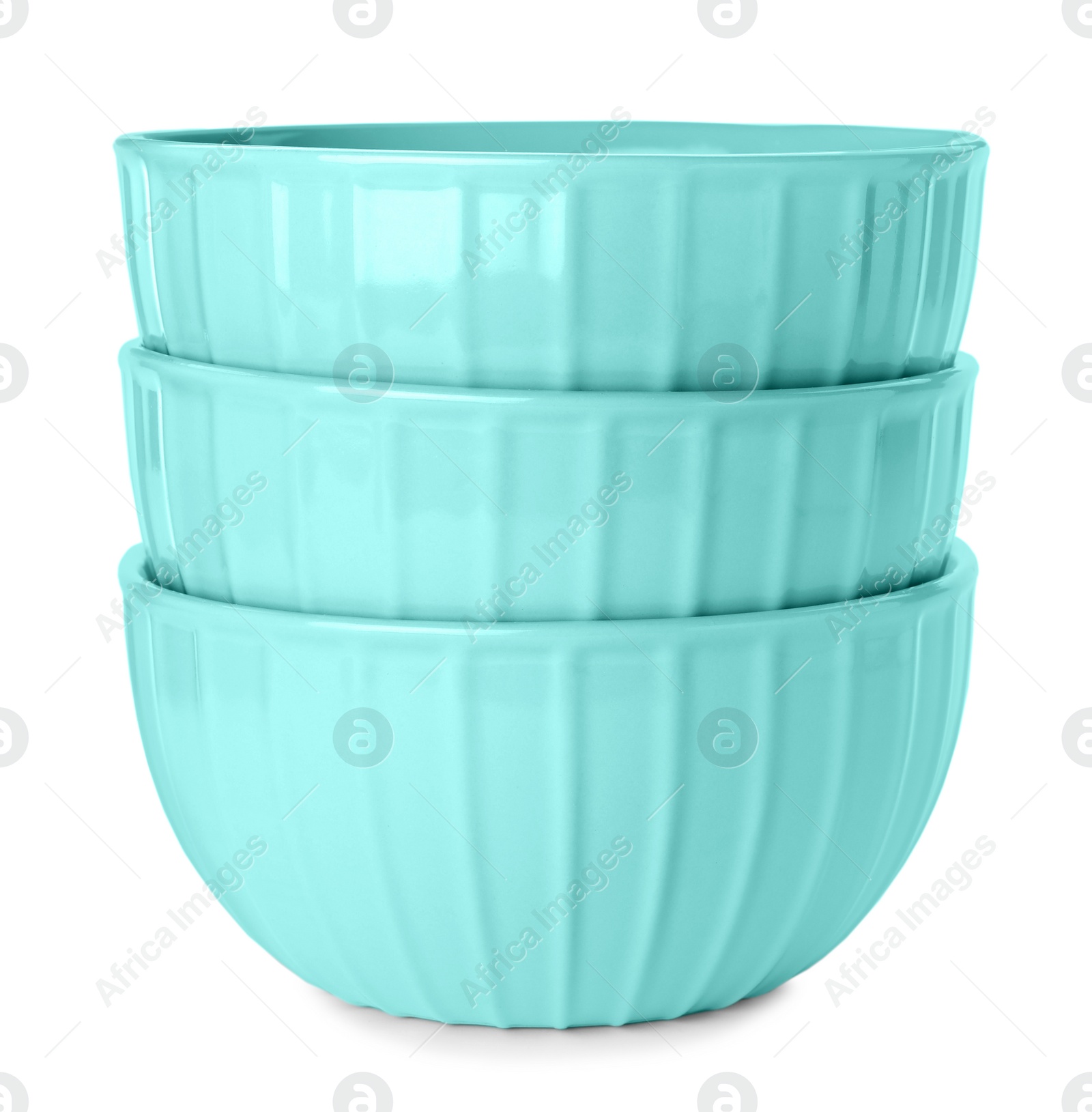 Elegant new turquoise bowls on white background Photo of Elegant new turquoise bowls on white background