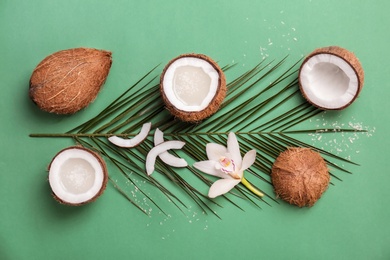 Composition with coconut water and fresh nuts on color background Photo of Composition with coconut water and fresh nuts on color background