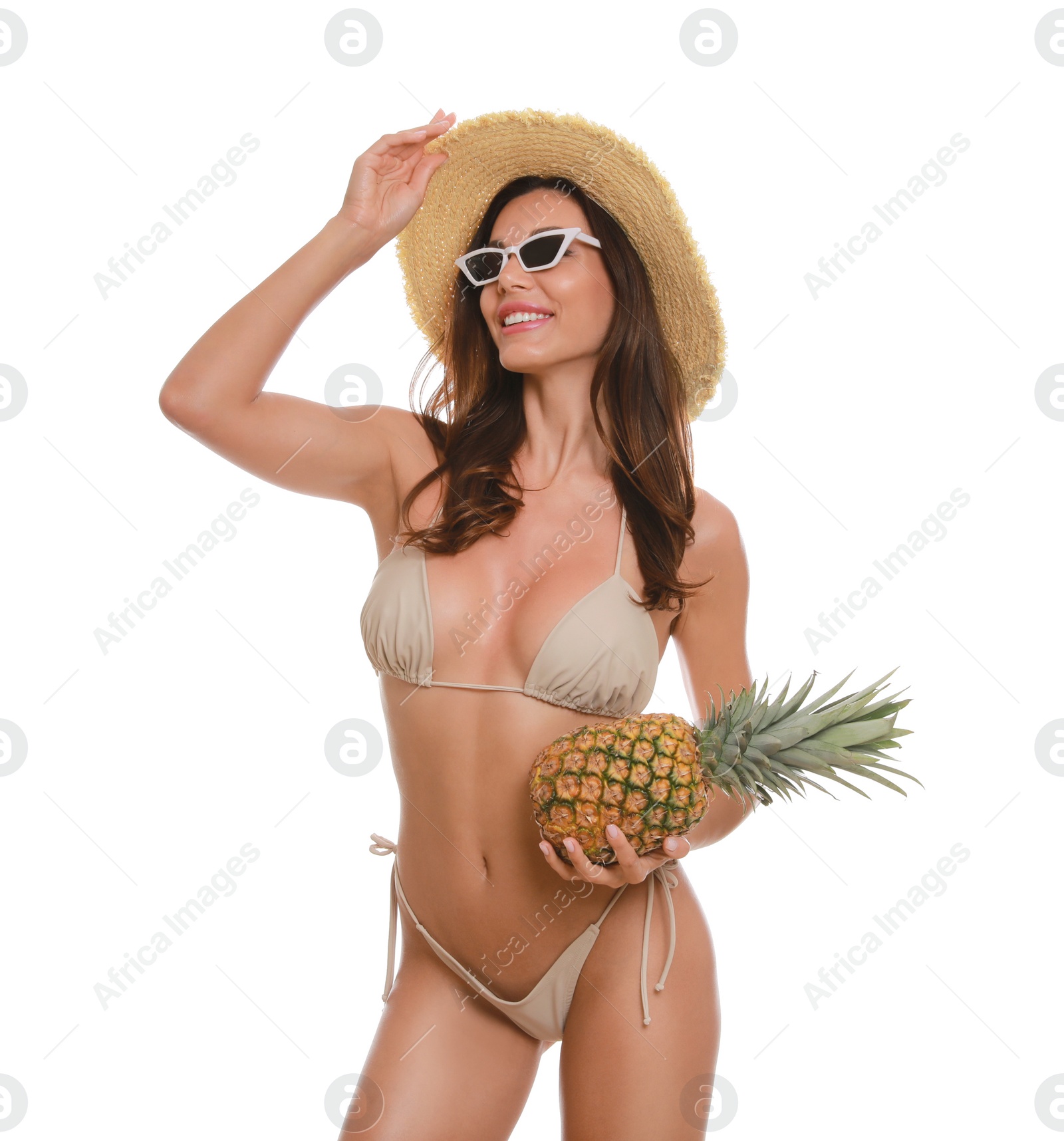 Beautiful woman in stylish bikini with pineapple on white background Photo of Beautiful woman in stylish bikini with pineapple on white background