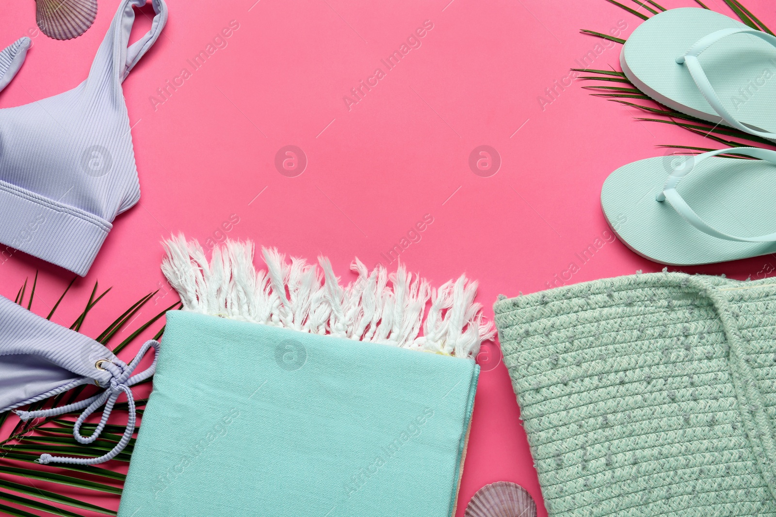 Flat lay composition with different beach objects on pink background, space for text Photo of Flat lay composition with different beach objects on pink background, space for text