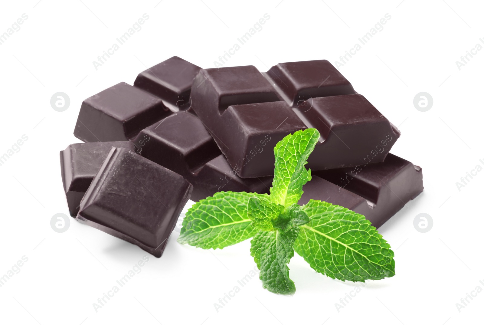Tasty dark chocolate pieces and mint on white background Image of Tasty dark chocolate pieces and mint on white background