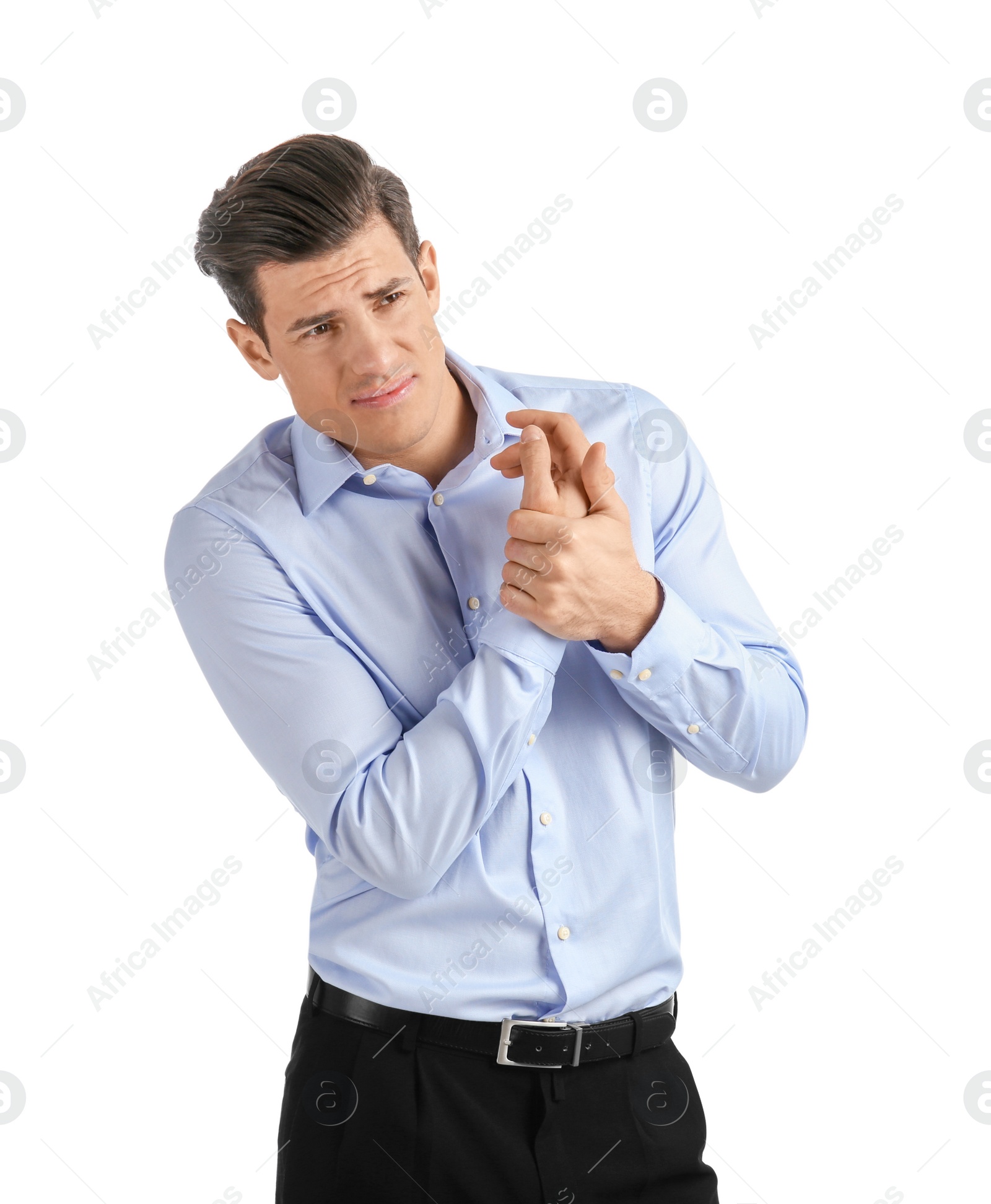 Young man suffering from pain in wrist on white background Photo of Young man suffering from pain in wrist on white background