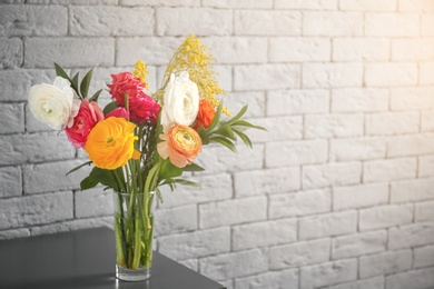 Vase with beautiful ranunculus flowers indoors Photo of Vase with beautiful ranunculus flowers indoors