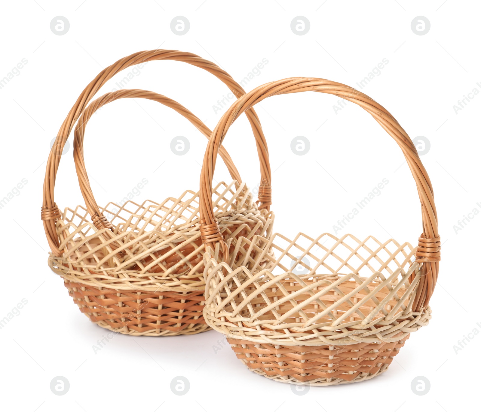 Three decorative wicker baskets on white background Photo of Three decorative wicker baskets on white background