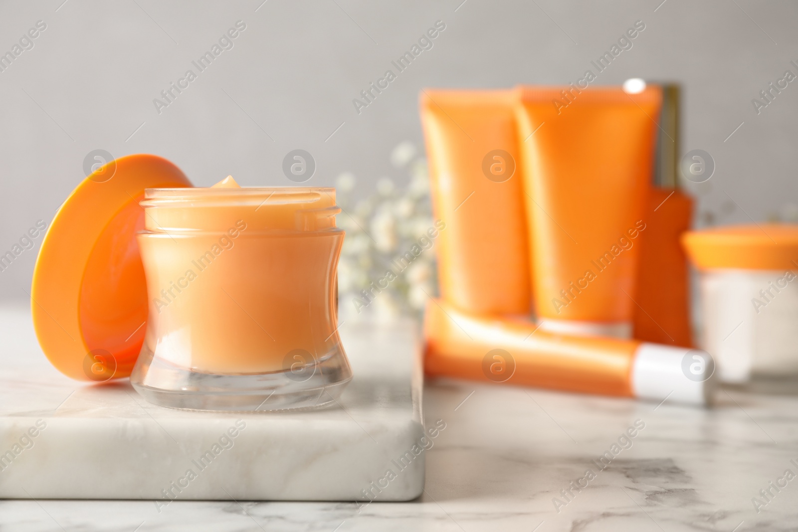 Luxury cosmetic products on white marble table, closeup. Space for text Photo of Luxury cosmetic products on white marble table, closeup. Space for text