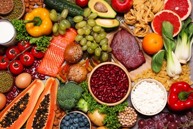 Photo of Different products on grey table, top view. Healthy food and balanced diet