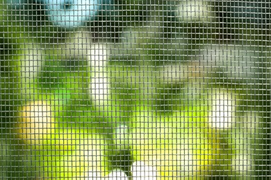 Insect screen for window against blurred background, closeup Photo of Insect screen for window against blurred background, closeup