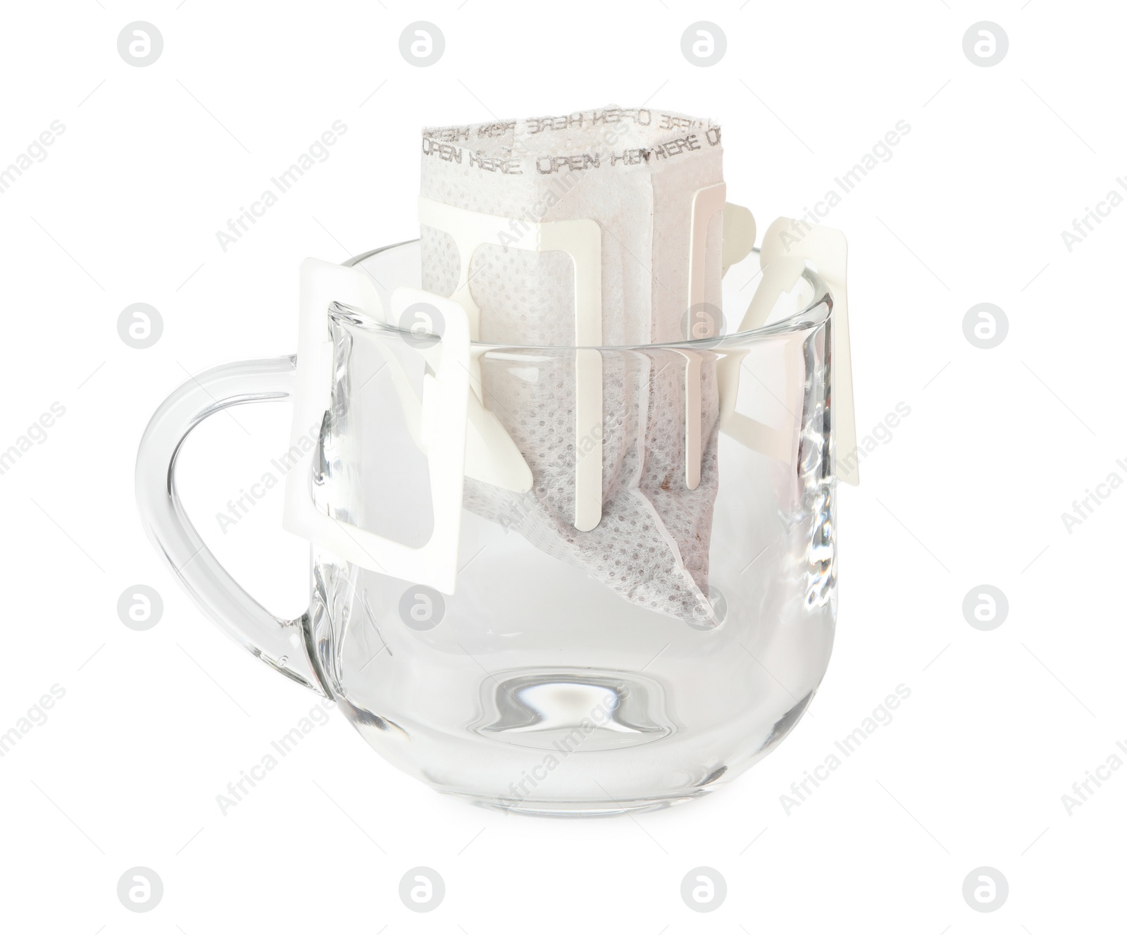 Glass cup with drip coffee bag isolated on white Photo of Glass cup with drip coffee bag isolated on white