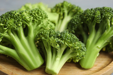 Fresh green broccoli on wooden board, closeup Photo of Fresh green broccoli on wooden board, closeup
