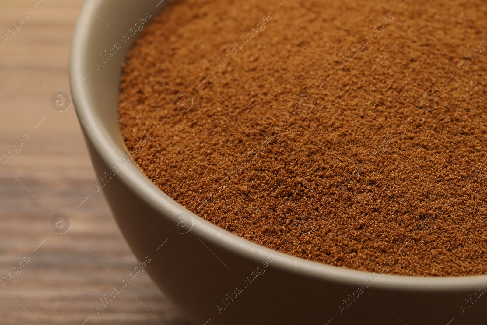 Bowl of chicory powder on wooden table, closeup Photo of Bowl of chicory powder on wooden table, closeup
