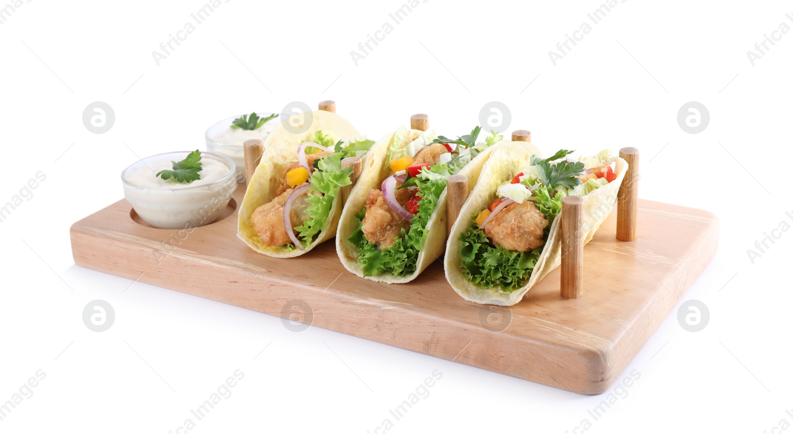 Yummy fish tacos with sauce isolated on white Photo of Yummy fish tacos with sauce isolated on white