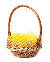 Wicker basket with yellow filler isolated on white. Easter item Photo of Wicker basket with yellow filler isolated on white. Easter item