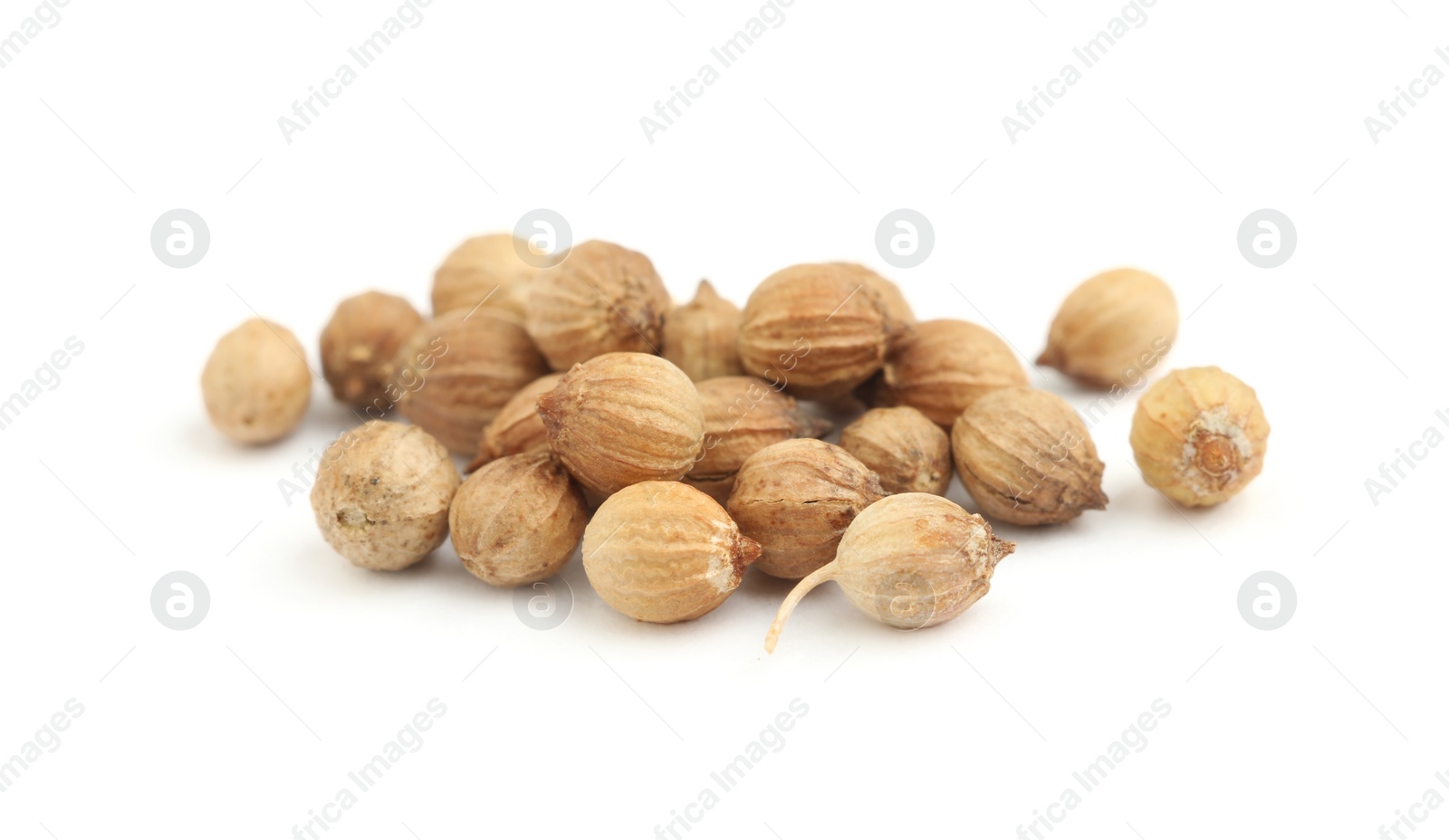 Photo of Heap of dried coriander seeds on white background