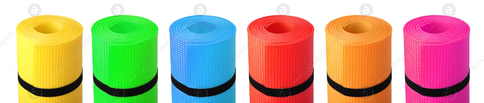 Image of Set with different bright rolled camping mats on white background. Banner design  