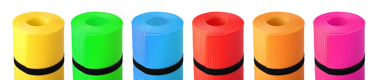 Set with different bright rolled camping mats on white background. Banner design Image of Set with different bright rolled camping mats on white background. Banner design