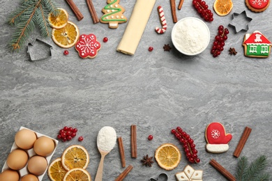 Frame of Christmas cookies and flour on grey table, flat lay. Space for text Photo of Frame of Christmas cookies and flour on grey table, flat lay. Space for text