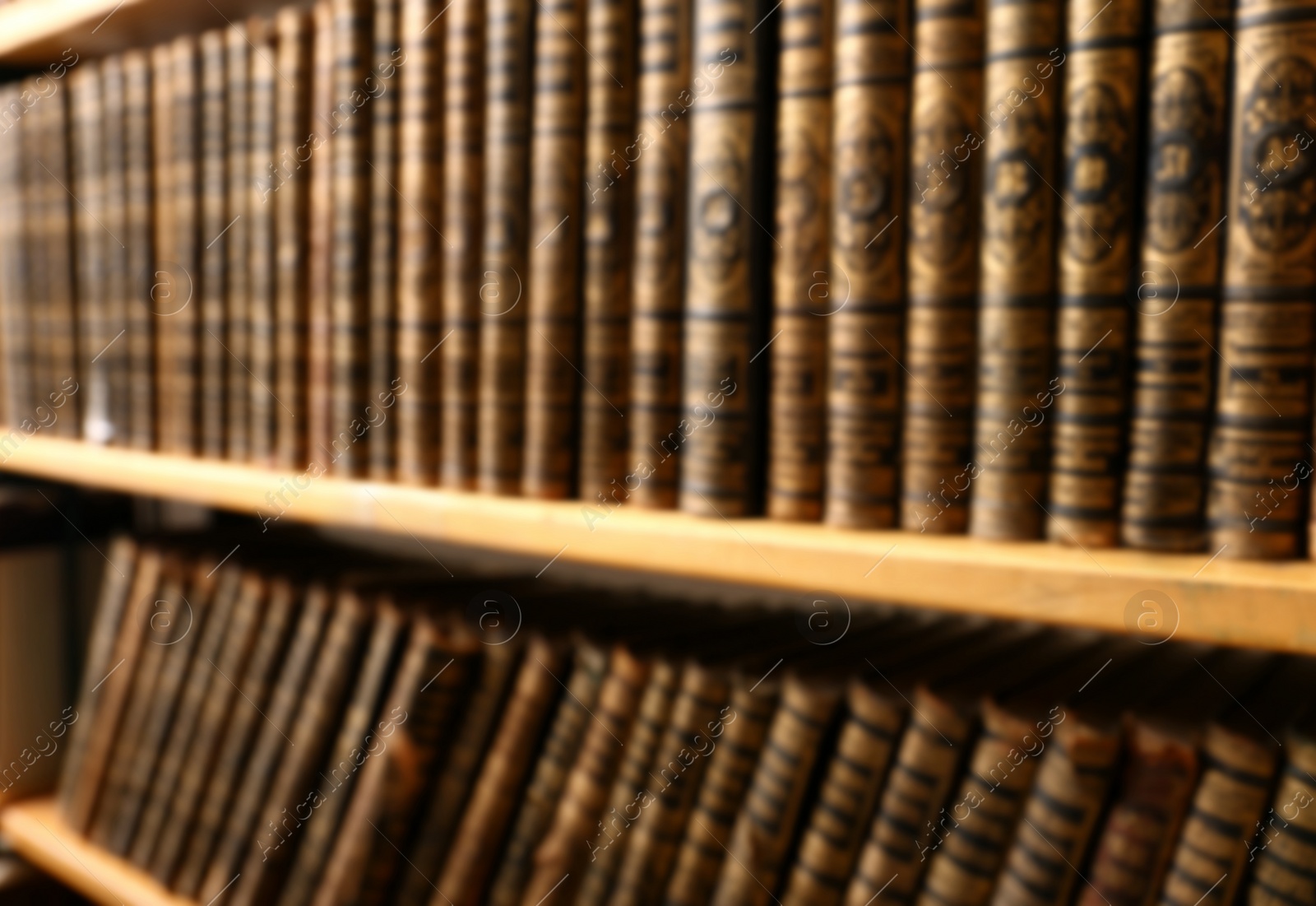 Blurred view of books on shelves in library Photo of Blurred view of books on shelves in library