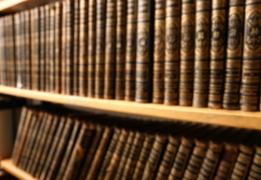 Blurred view of books on shelves in library Photo of Blurred view of books on shelves in library