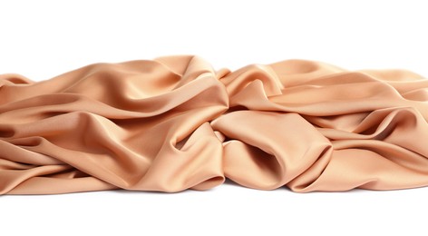 Beautiful delicate peach silk on white background Photo of Beautiful delicate peach silk on white background