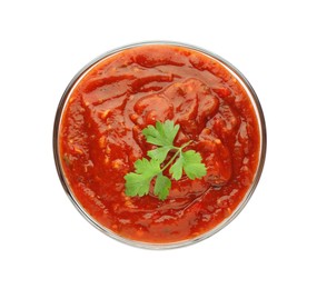 Delicious adjika sauce and parsley in bowl isolated on white, top view Photo of Delicious adjika sauce and parsley in bowl isolated on white, top view