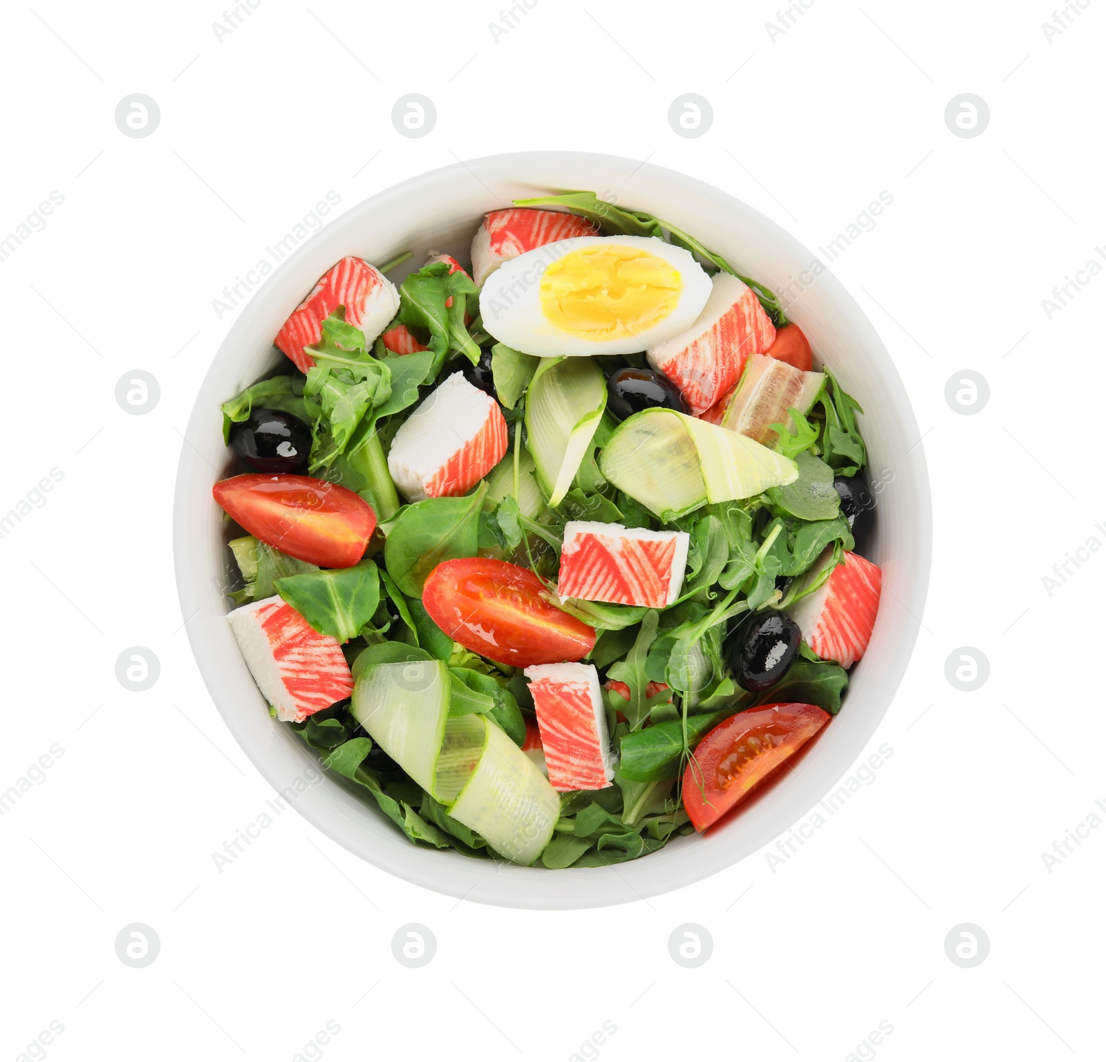 Delicious crab stick salad in bowl isolated on white, top view Photo of Delicious crab stick salad in bowl isolated on white, top view