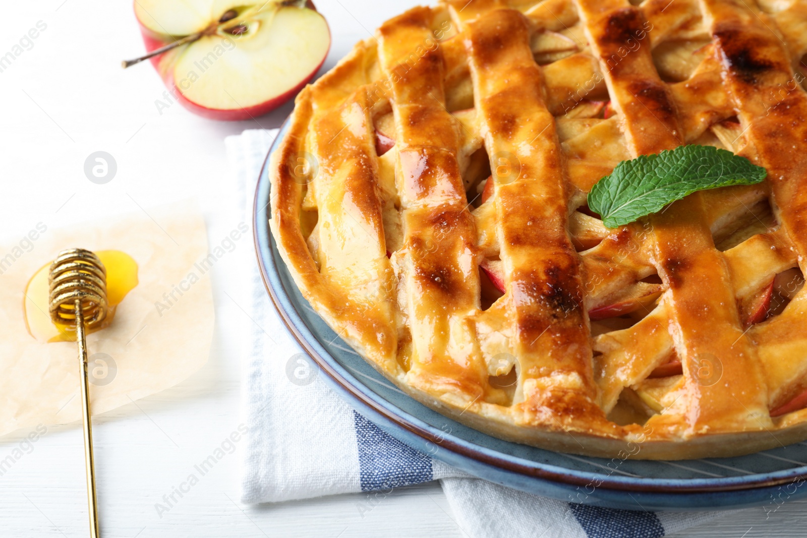 Fresh traditional apple pie on white table, closeup Photo of Fresh traditional apple pie on white table, closeup