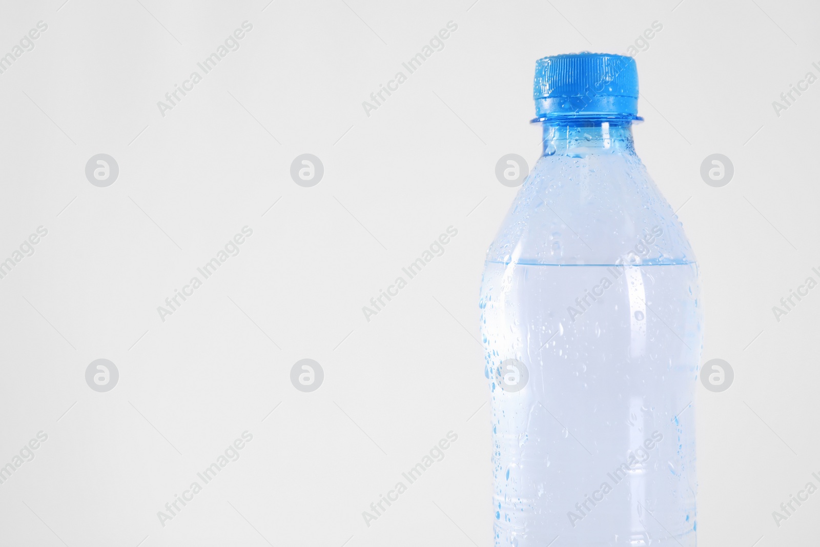Plastic bottle with pure water isolated on white Photo of Plastic bottle with pure water isolated on white