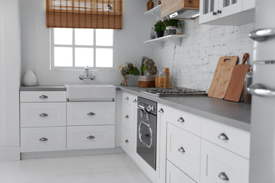 Beautiful kitchen interior with new stylish furniture Photo of Beautiful kitchen interior with new stylish furniture