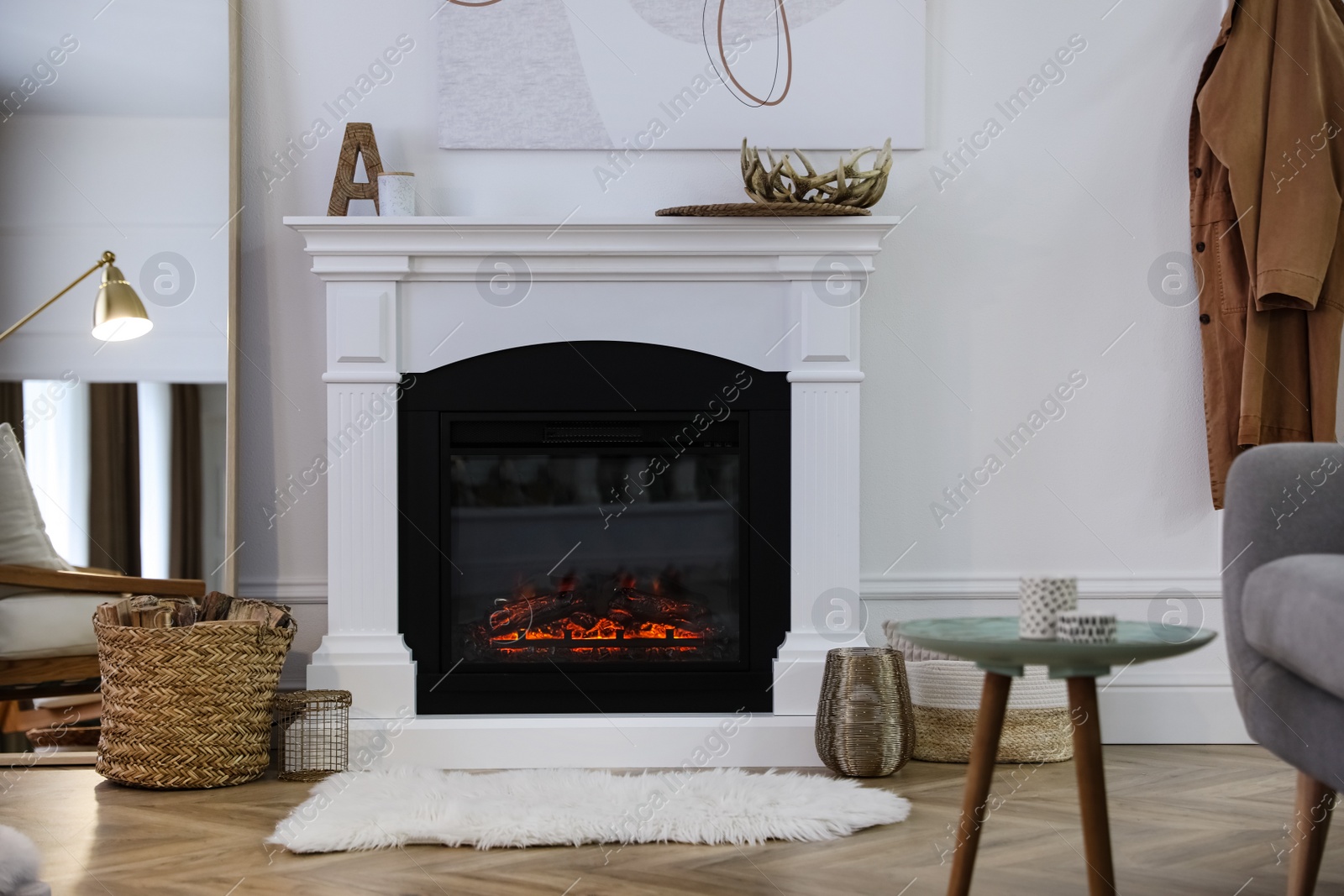 Beautiful living room interior with fireplace near white wall Photo of Beautiful living room interior with fireplace near white wall