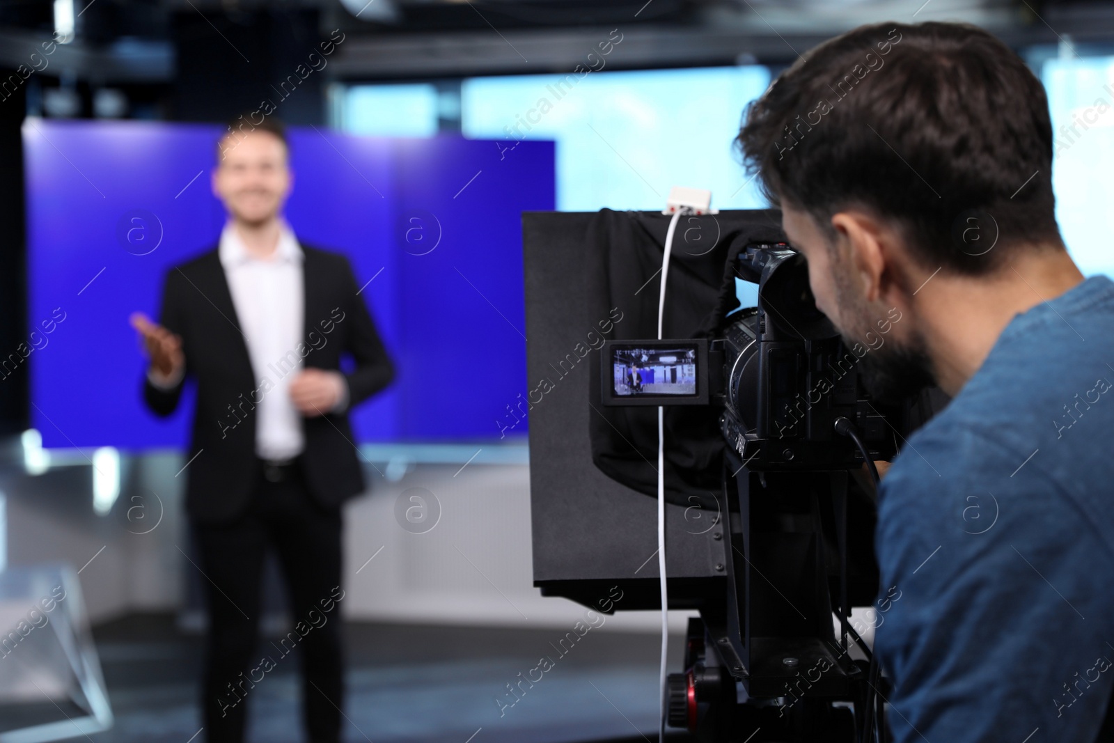 Professional video camera operator working in studio, closeup Photo of Professional video camera operator working in studio, closeup