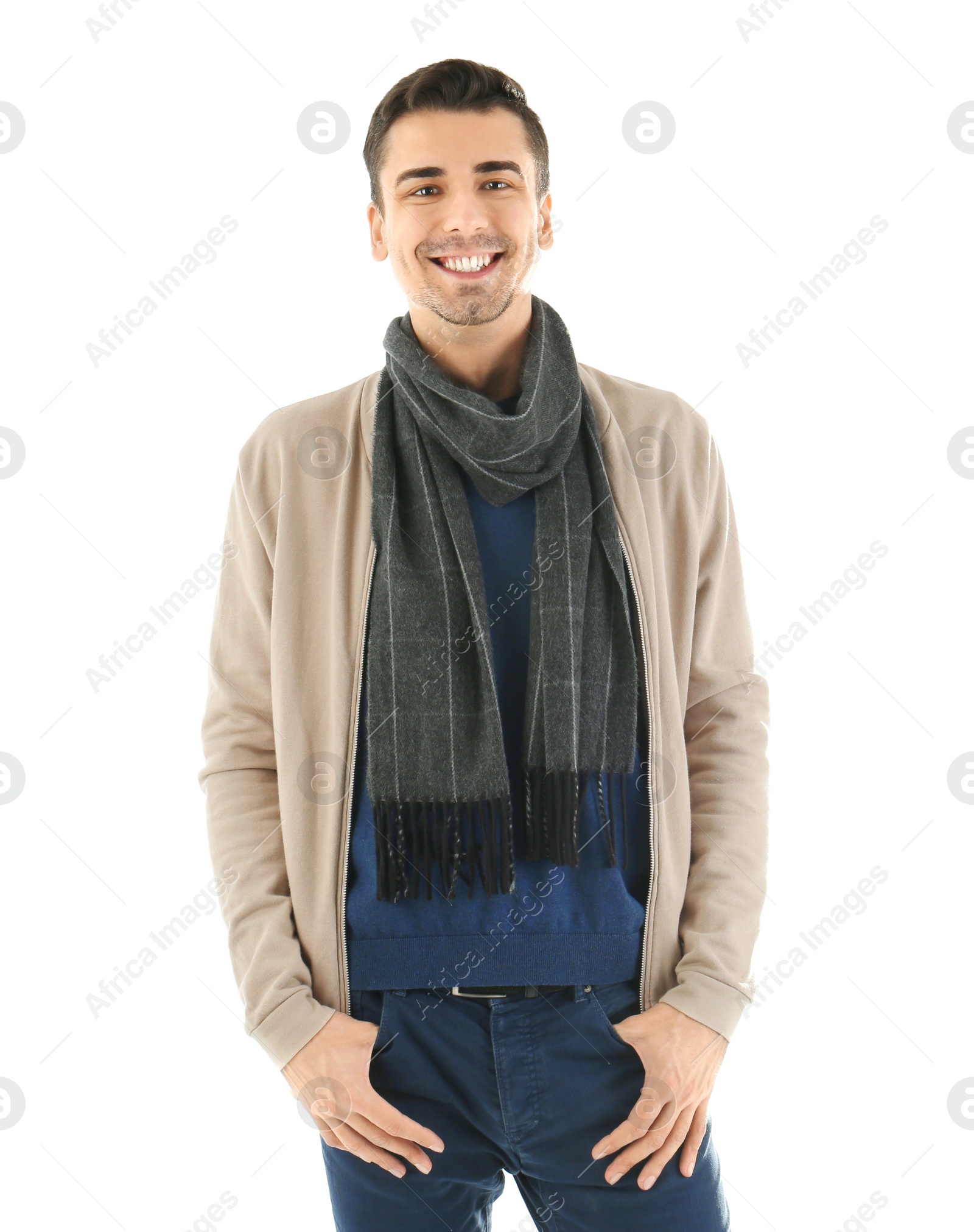 Portrait of happy young man in warm clothing on white background. Ready for winter vacation Photo of Portrait of happy young man in warm clothing on white background. Ready for winter vacation