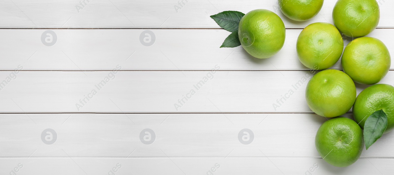 Fresh ripe sweeties on white wooden table, flat lay. Space for text Photo of Fresh ripe sweeties on white wooden table, flat lay. Space for text