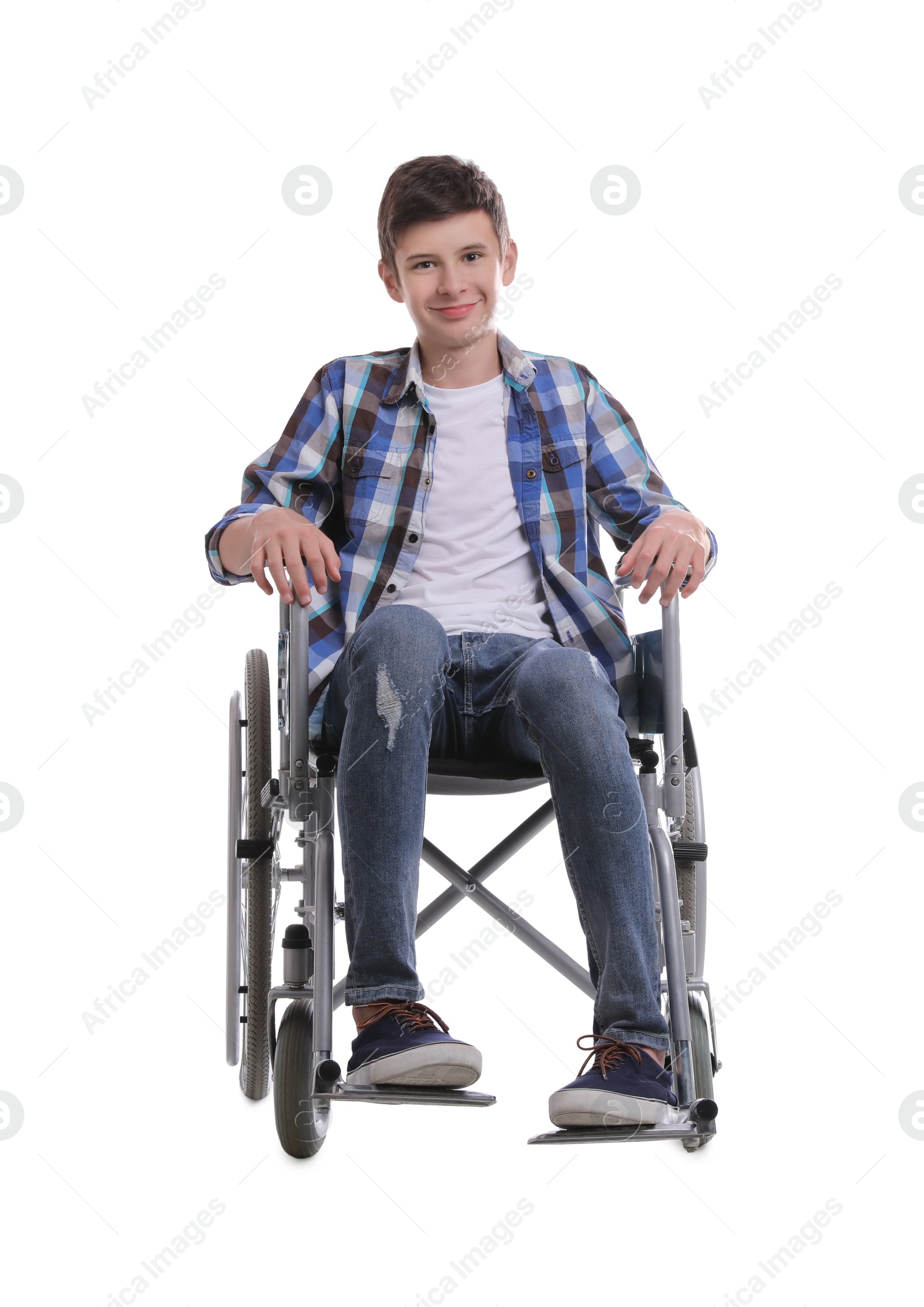 Teen boy in wheelchair on white background Photo of Teen boy in wheelchair on white background