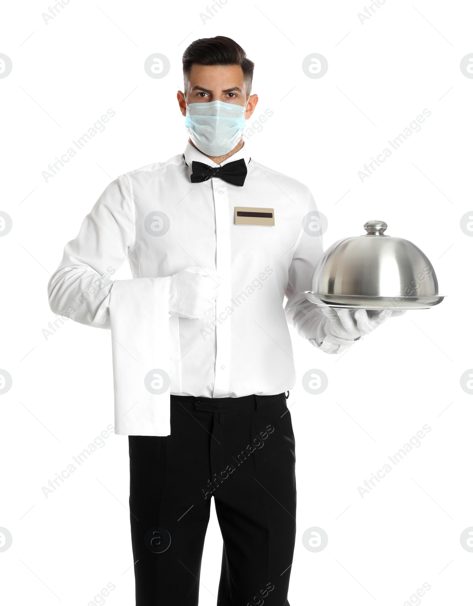 Waiter in medical face mask holding tray with lid on white background Photo of Waiter in medical face mask holding tray with lid on white background