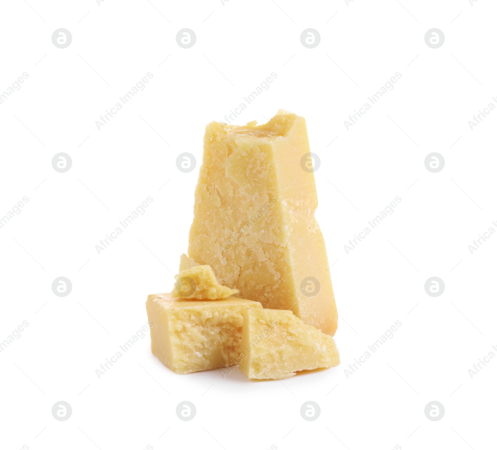 Pieces of delicious parmesan cheese on white background Photo of Pieces of delicious parmesan cheese on white background
