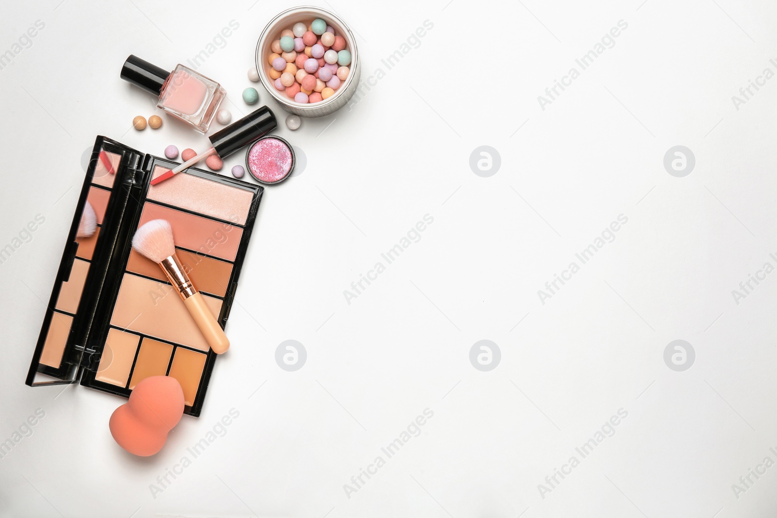 Photo of Decorative makeup products on white background