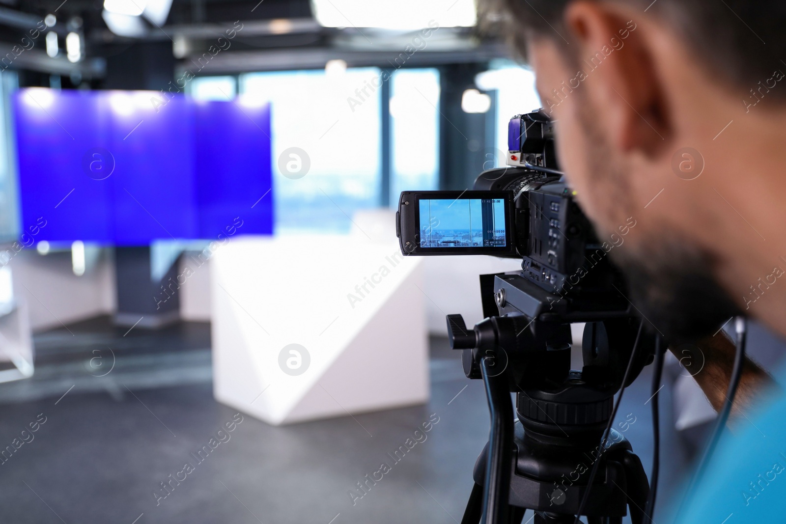 Professional video camera operator working in studio, closeup Photo of Professional video camera operator working in studio, closeup