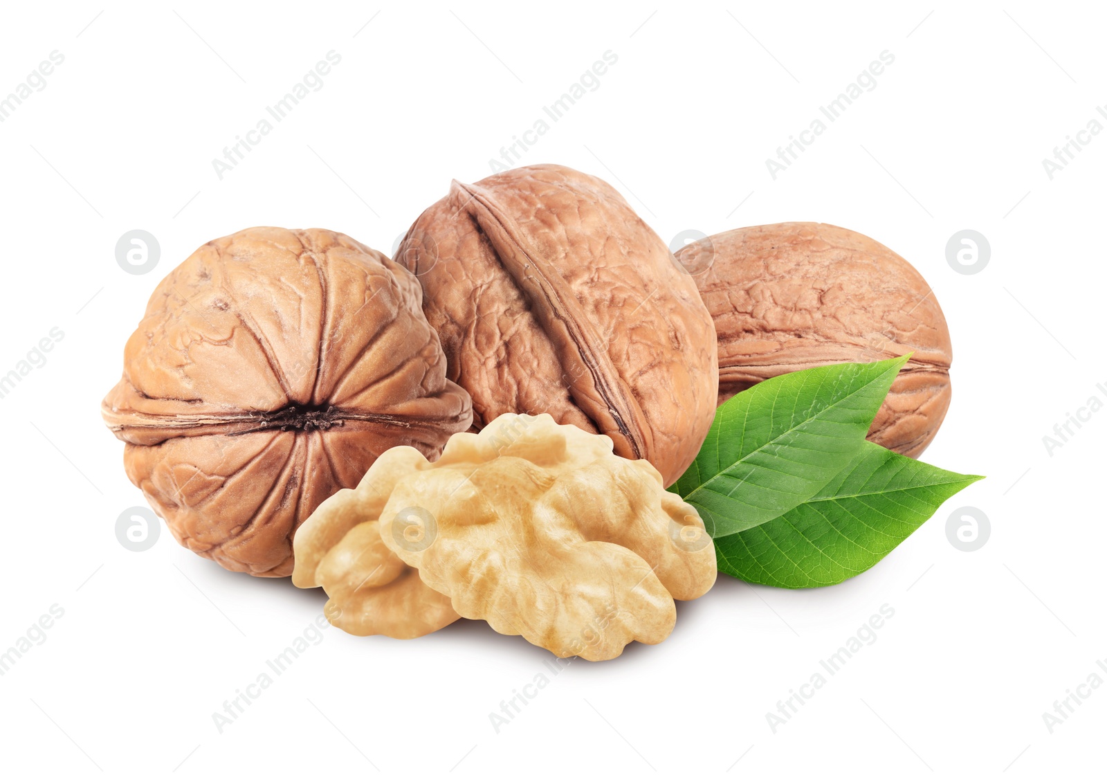 Tasty walnuts and green leaves on white background Image of Tasty walnuts and green leaves on white background