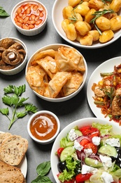 Buffet service. Many different dishes on grey table, flat lay Photo of Buffet service. Many different dishes on grey table, flat lay