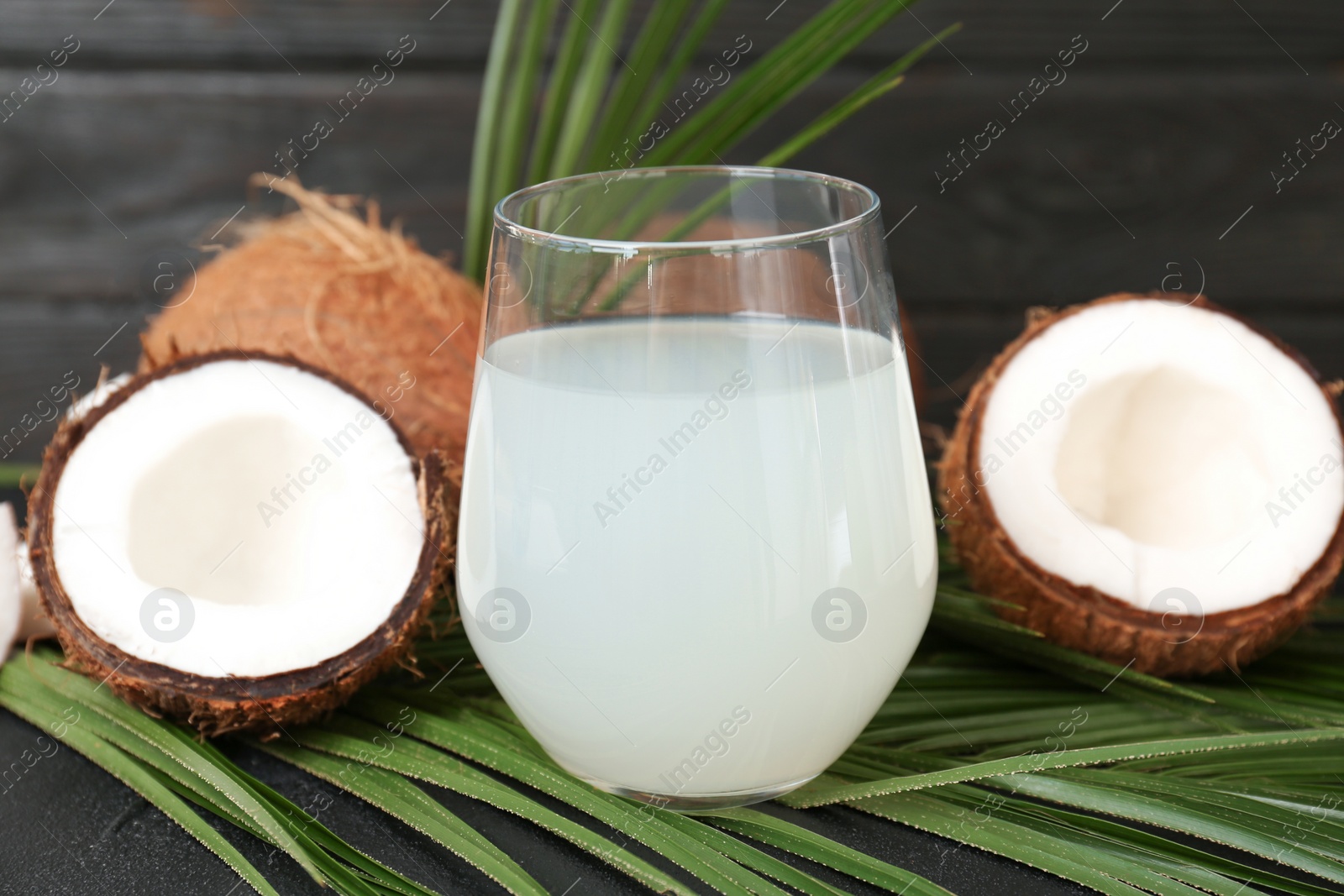 Glass of coconut water on table Photo of Glass of coconut water on table