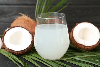 Glass of coconut water on table Photo of Glass of coconut water on table