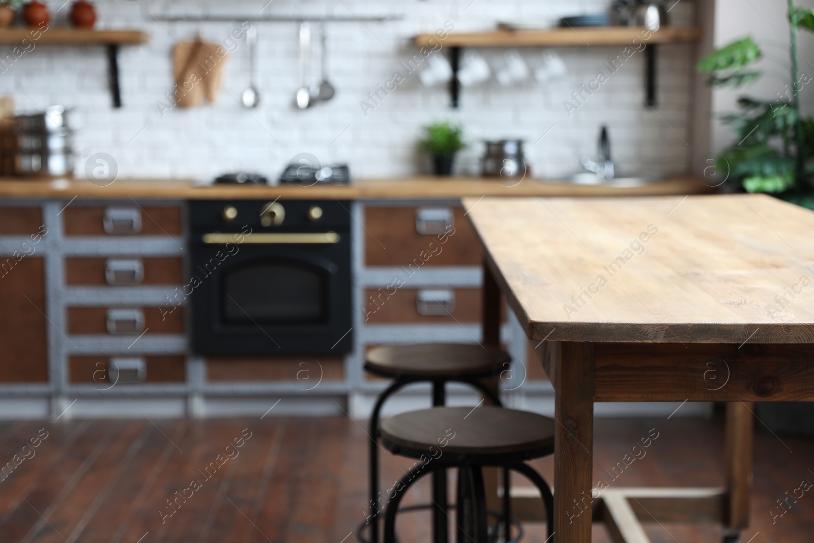 Empty wooden table in beautiful kitchen. Interior design Photo of Empty wooden table in beautiful kitchen. Interior design