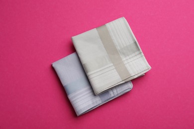 Stylish handkerchiefs on pink background, flat lay Photo of Stylish handkerchiefs on pink background, flat lay