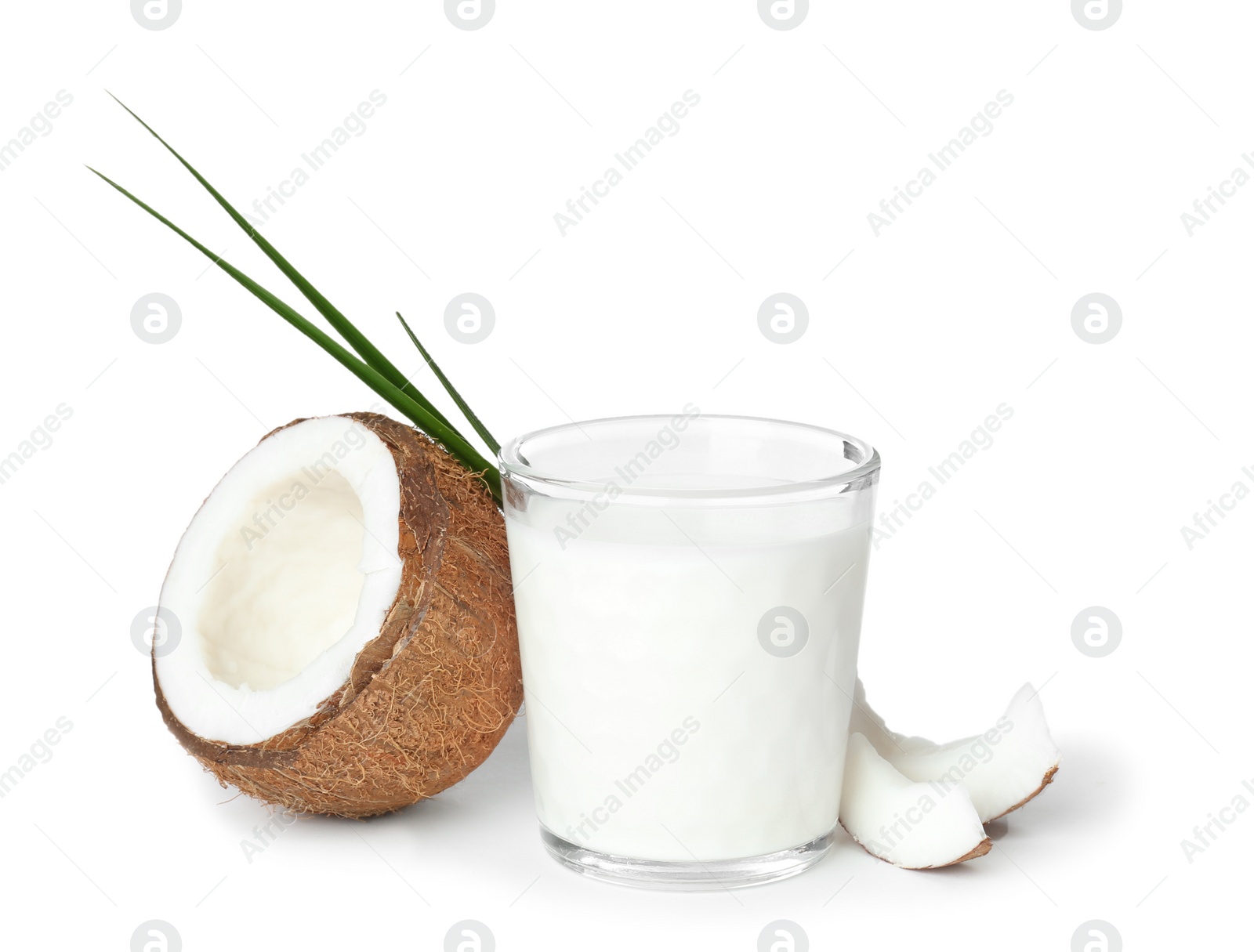 Glass of coconut milk and fresh nut on white background Photo of Glass of coconut milk and fresh nut on white background