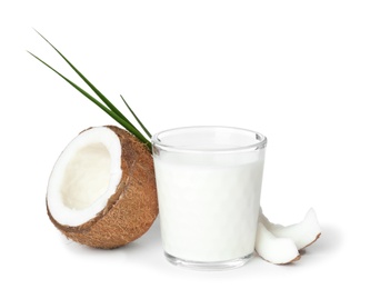 Glass of coconut milk and fresh nut on white background Photo of Glass of coconut milk and fresh nut on white background