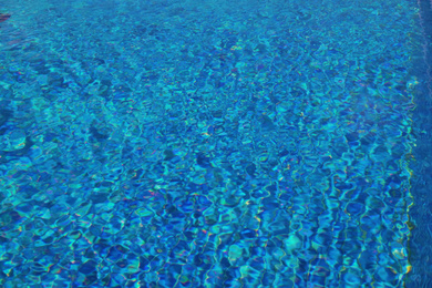 Photo of Outdoor swimming pool with clear water on sunny day