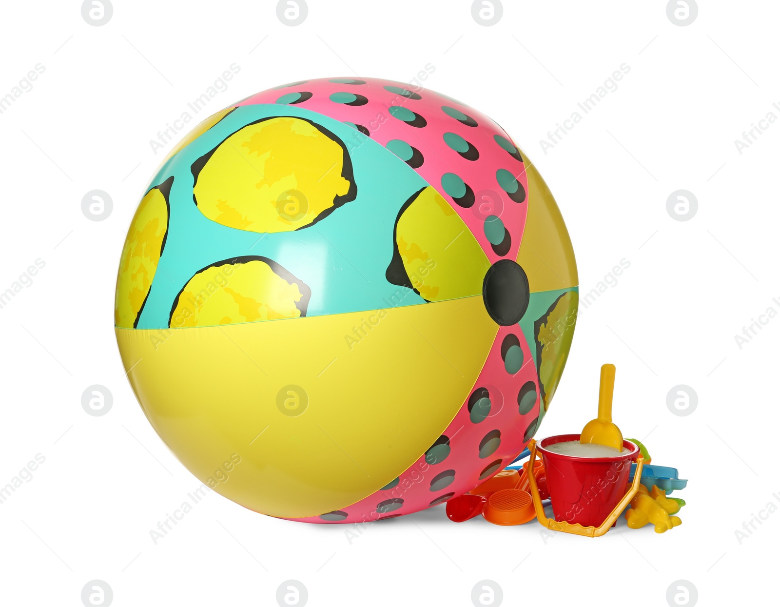 Inflatable colorful beach ball and child plastic toys on white background Photo of Inflatable colorful beach ball and child plastic toys on white background