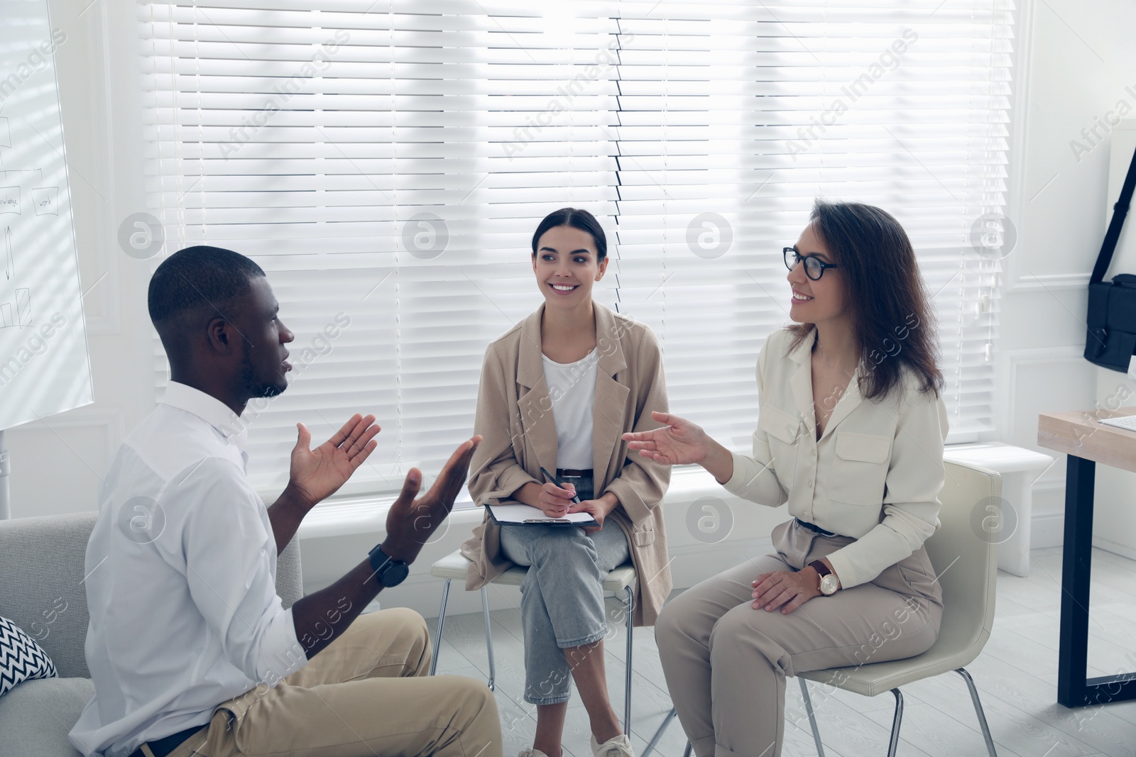 Job interview with new coworker in office Photo of Job interview with new coworker in office